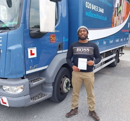 A photograph of Romain on gaining his Cat C certificate via the Thames Freeport training program.